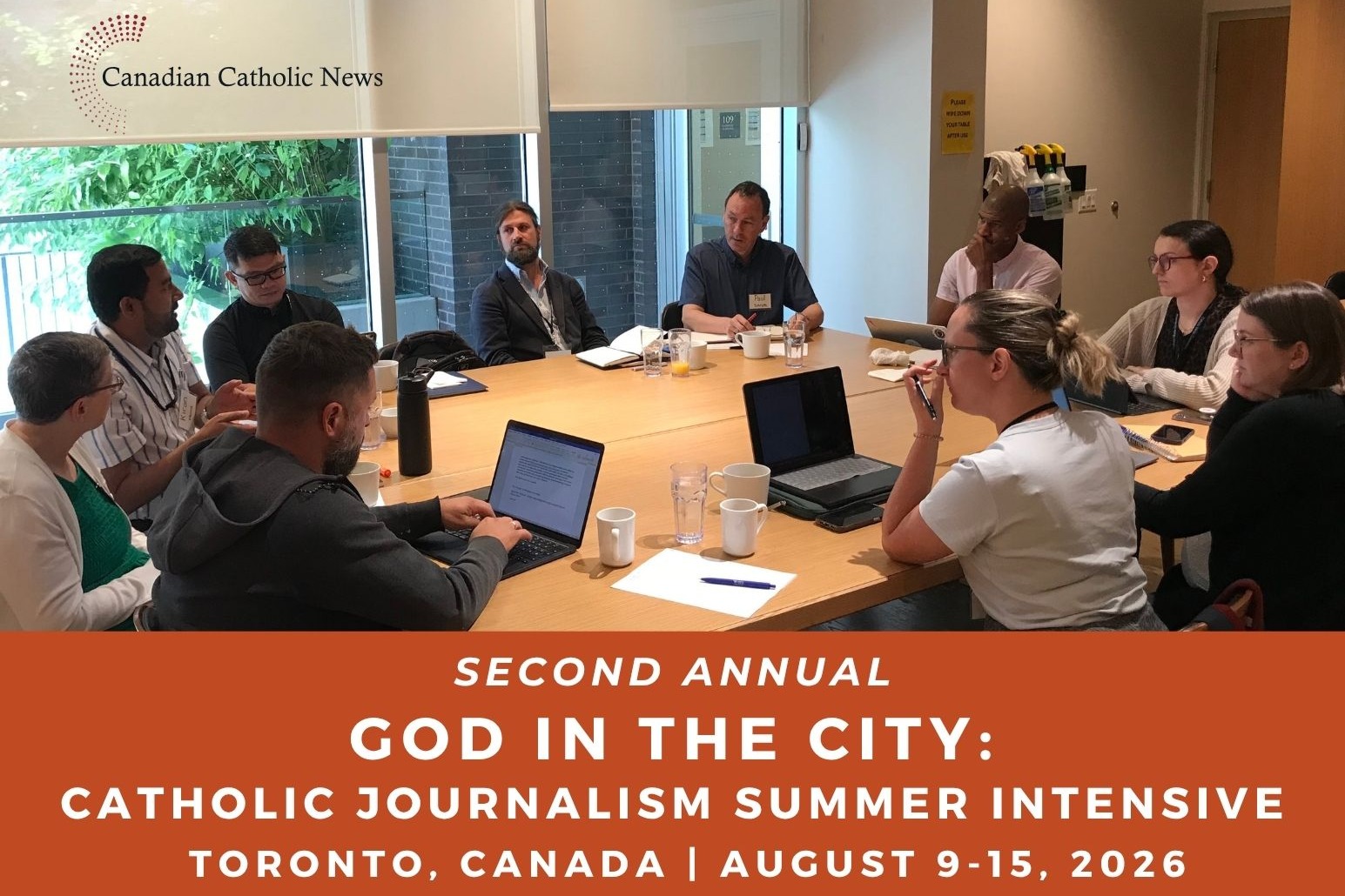 Round table discussion with laptops