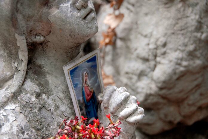 Virgin Mary Statue Closeup With Virgin Mary Photo